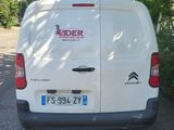 a white van that is parked on the side of the road
