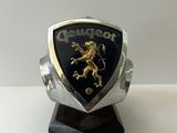 a close up of a silver and black ring with a lion on it