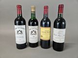 three bottles of wine are lined up on a table