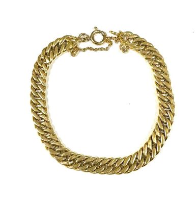 a close up of a gold chain bracelet on a white background
