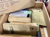 a box full of books sitting on top of a table