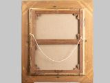 an old picture frame with a rope hanging from it ' s side