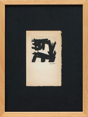 a black and white drawing in a wooden frame on a wall