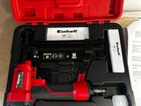 a red box with a tool in it on the floor