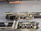two clarinets sitting next to each other on a table