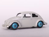 a white toy car with blue wheels on a white surface