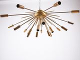 a large brass chandelier hanging from the ceiling