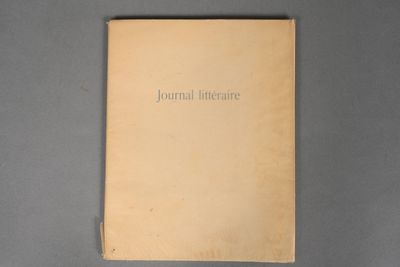 the book is open on a gray surface with a black background