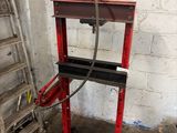an image of a red machine in a garage