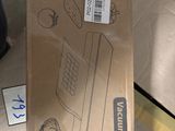 someone is holding a box with a keyboard and mouse inside of it