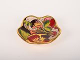 yellow, red, and white plate with a woman in a boat holding a bouquet of flowers