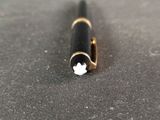 a pen that is laying on top of a table