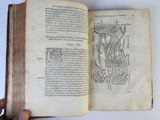 an open book with a drawing of a human torso on it