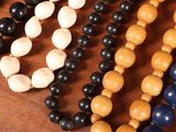 many different colored beads on a table together