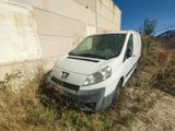 a white van that is parked in the grass