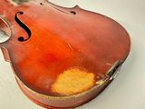 a violin that is sitting on a table in a room