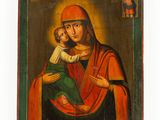 an old painting of a woman holding a child in her arms
