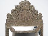 a mirror that is sitting on top of a table