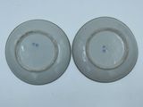 two plates that are sitting next to each other on a table