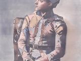 tableau représentant un homme assis sur une chaise, coiffé d'un chapeau
