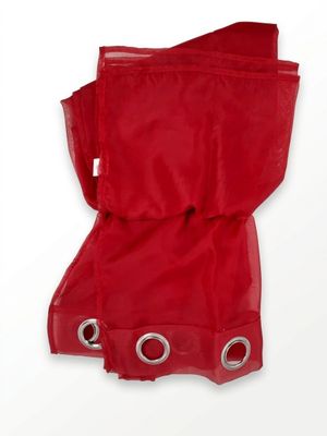 a red bag that has a pair of shoes on it