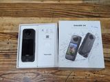 a box with a cell phone inside of it on a table