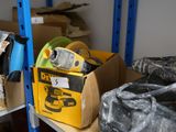 a box of tools sitting on a shelf in a room