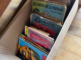 a box full of books sitting on the floor