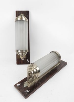 a close up of a light fixture on a wooden stand
