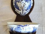 a picture of a blue and white plate and bowl on a shelf