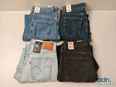 four pairs of levi ' s jeans are stacked on top of each other