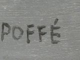 a close up of a piece of wood with writing on it