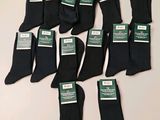 six paires de chaussettes de ville noires pour homme, avec leurs étiquettes