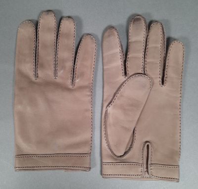 pair of tan leather gloves with stitching on the fingers
