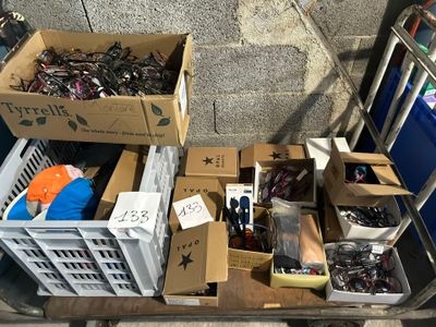 a cart full of assorted items on the street