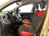 the interior of a car with red and black seats and a steering wheel