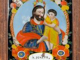 a painting of jesus holding a child in a wooden frame