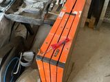 an orange box with a pair of scissors on top of it