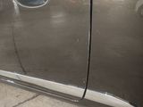 a car door handle with a hole in the side of it