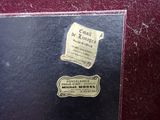 a black book with a gold label on it