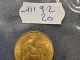 a close up of a coin in a plastic bag on a table