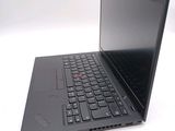 a laptop with a black keyboard on a white surface