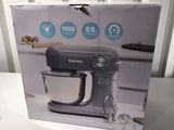 the box of the kitchenaid mixer is open on the table