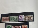 a book with a bunch of stamps sitting on top of a table