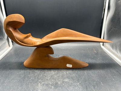 an image of a wooden sculpture of a bird