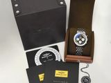 a box with a watch and other items on the table