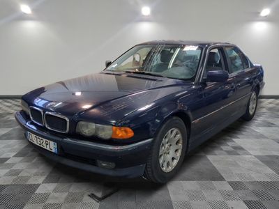 a picture of a blue car parked in a garage