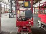 a red truck that is parked inside of a building