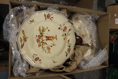 a box with a plate in it that is sitting on a table