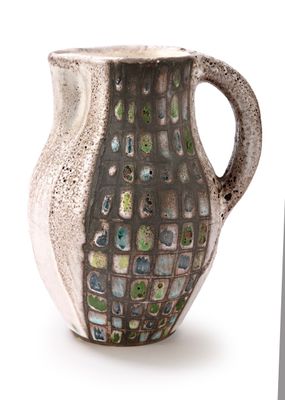 a white vase with a green and blue design on it